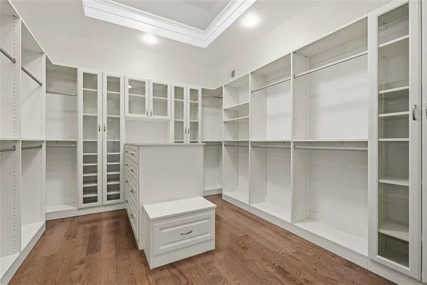 a bathroom with a tub a sink and mirror