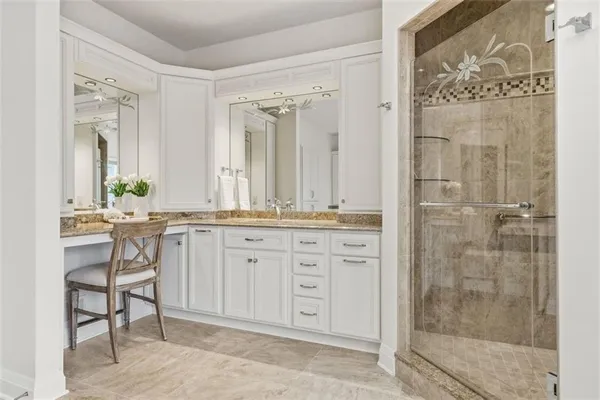 a bedroom with a large bed and dresser