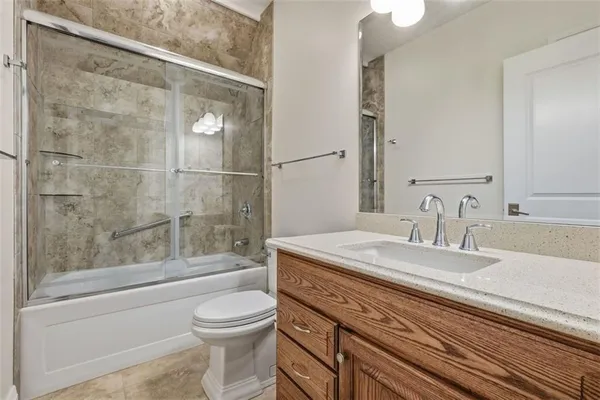 a view of a dining room with furniture wooden floor and a chandelier