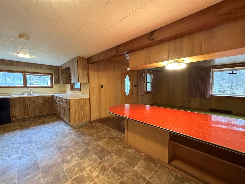 671 Solomon Temple Road Latrobe, PA 15650 - Photo 12 of 32 a large kitchen with stainless steel appliances granite countertop a sink and cabinets