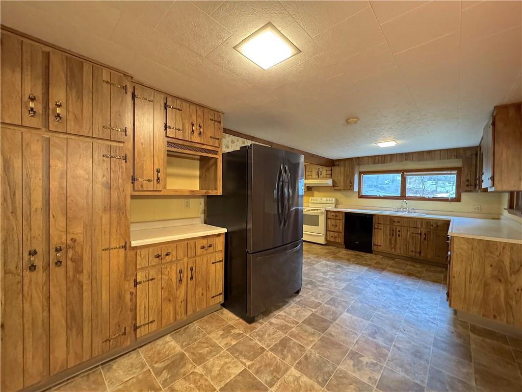 671 Solomon Temple Road Latrobe, PA 15650 - Photo 14 of 32 a kitchen with stainless steel appliances granite countertop a refrigerator and a stove