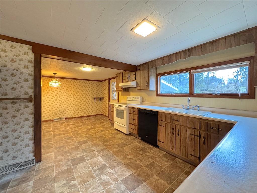 671 Solomon Temple Road Latrobe, PA 15650 - Photo 15 of 32 a large kitchen with stainless steel appliances granite countertop a sink and cabinets