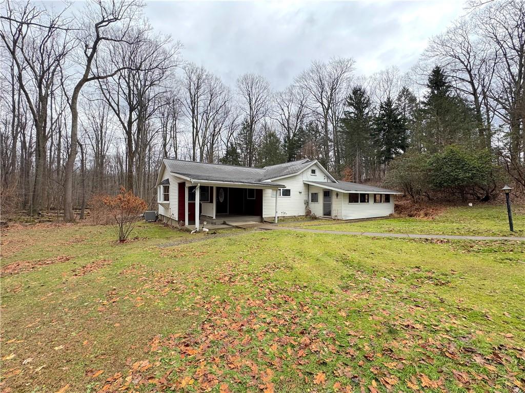 671 Solomon Temple Road Latrobe, PA 15650 - Photo 4 of 32 a front view of a house with a yard