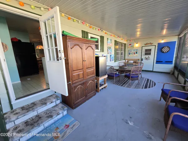 a room with furniture and wooden floor