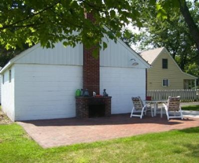 8745 Kleinman Road Highland, IN 46322 - Photo 3 of 8 a backyard of a house with table and chairs