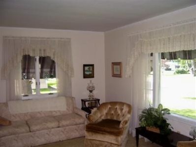 8745 Kleinman Road Highland, IN 46322 - Photo 7 of 8 a living room with furniture and a window