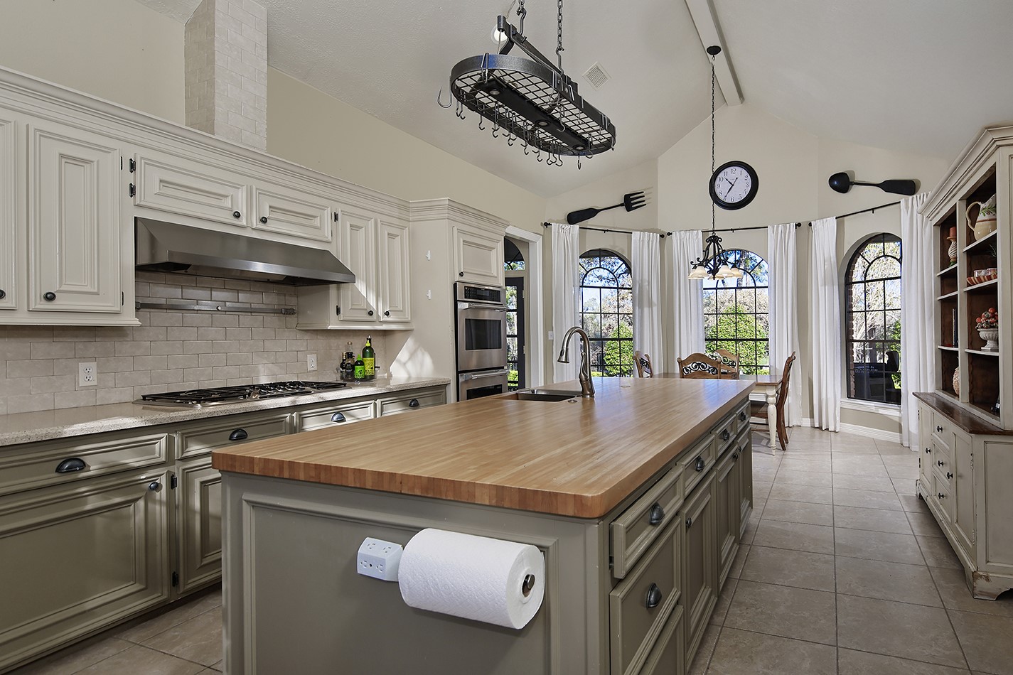 24635 West Kingscrest Circle Spring, TX 77389 - Photo 13 of 38 a kitchen with stainless steel appliances granite countertop a sink a stove and a wooden floors