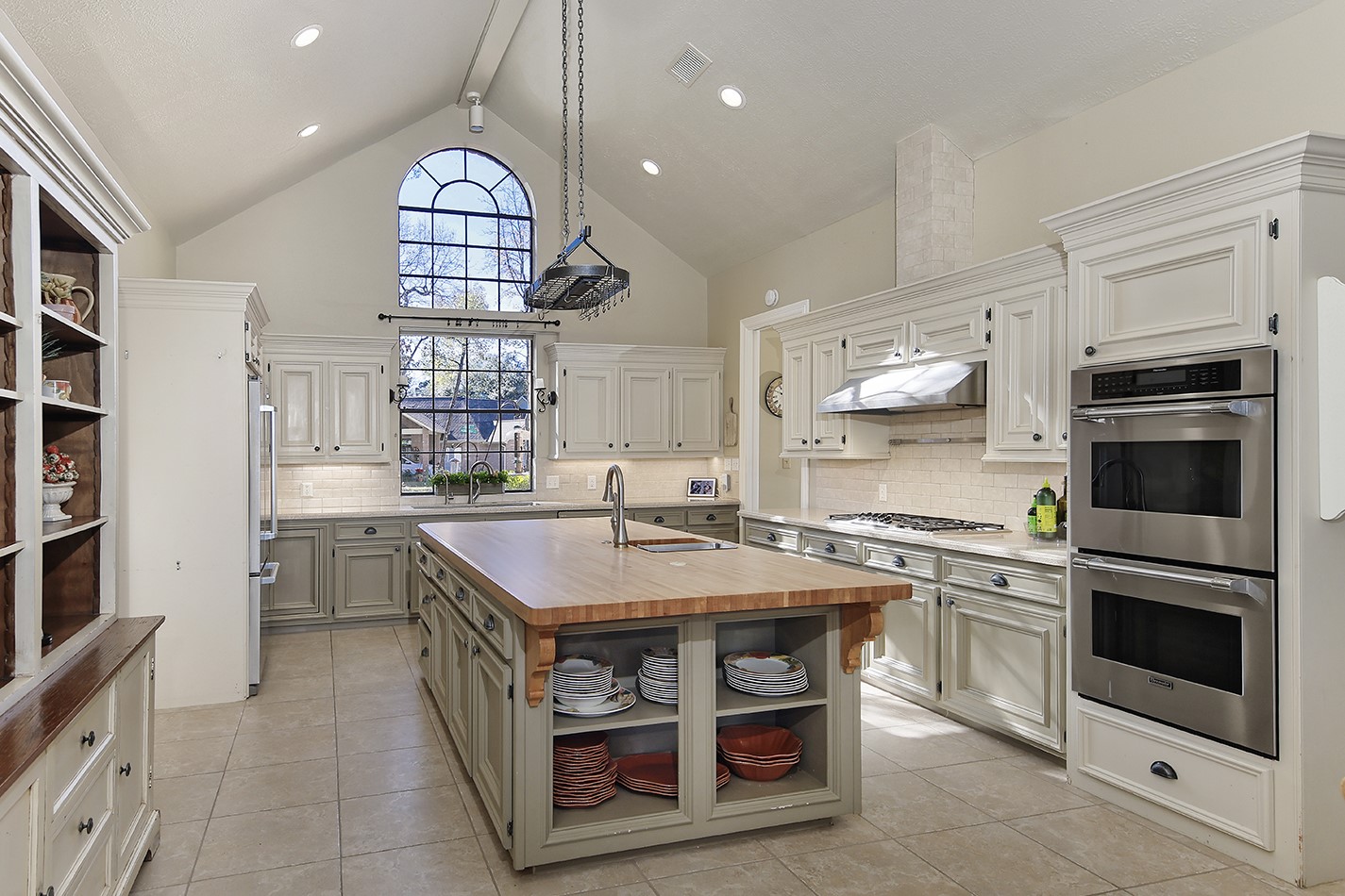 24635 West Kingscrest Circle Spring, TX 77389 - Photo 16 of 38 a kitchen with a stove and a microwave
