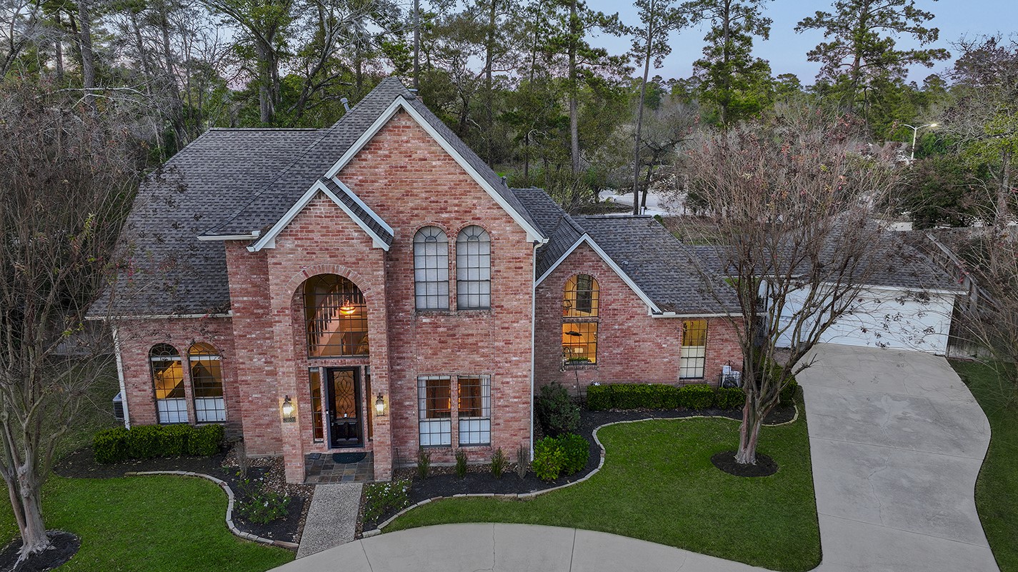 24635 West Kingscrest Circle Spring, TX 77389 - Photo 2 of 38 front view of house with a yard
