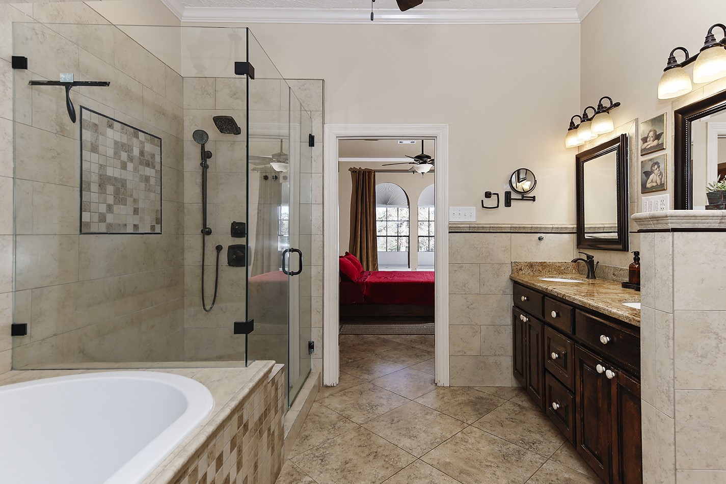 24635 West Kingscrest Circle Spring, TX 77389 - Photo 21 of 38 a spacious bathroom with a bathtub sink and mirror