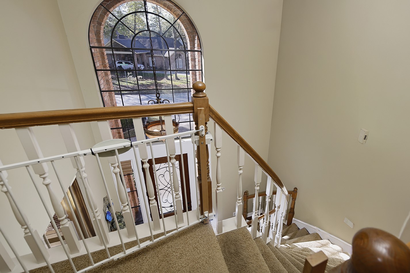 24635 West Kingscrest Circle Spring, TX 77389 - Photo 24 of 38 a view of staircase with wooden floor and stairs