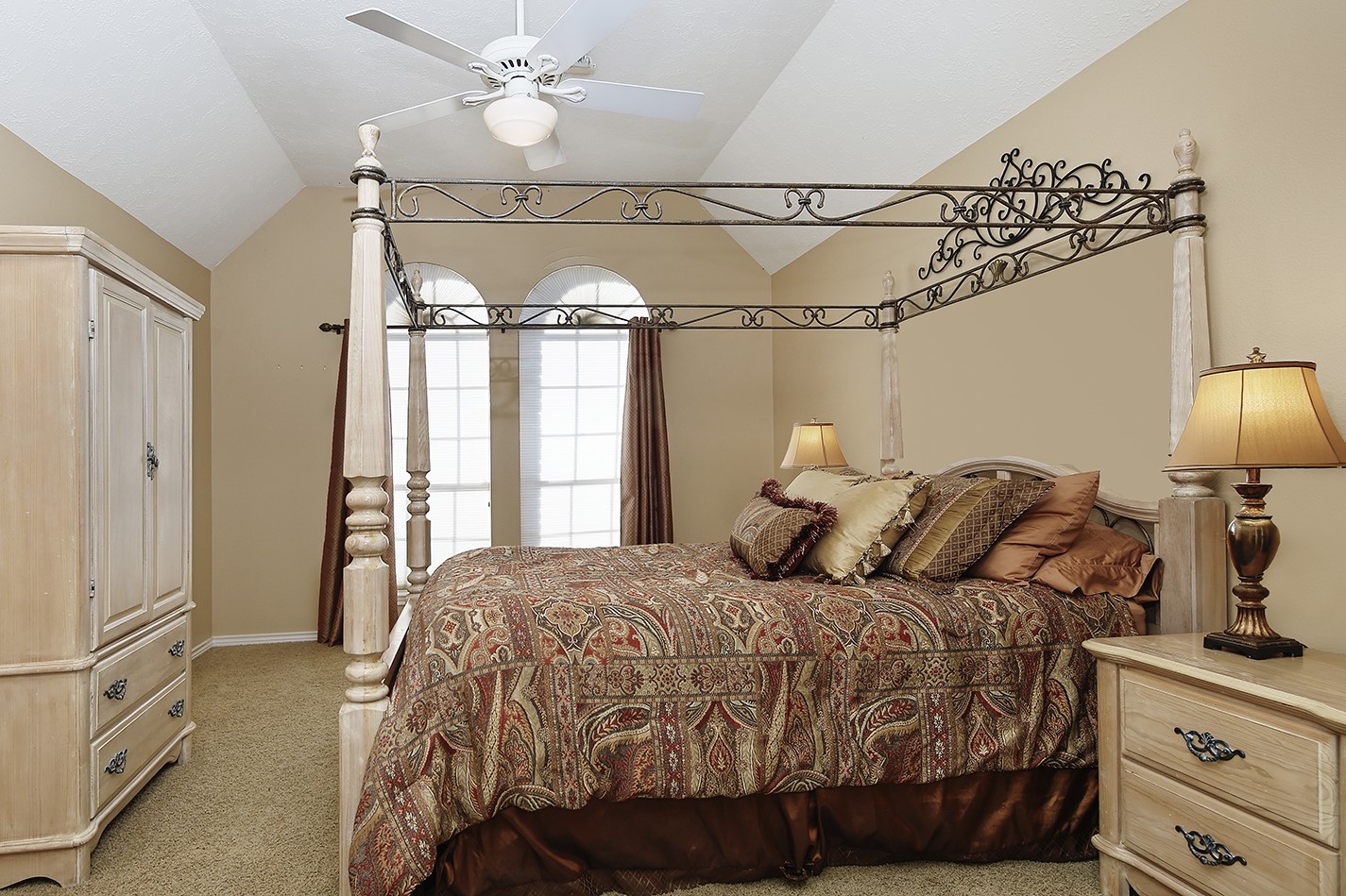 24635 West Kingscrest Circle Spring, TX 77389 - Photo 26 of 38 a bedroom with a bed and a chandelier