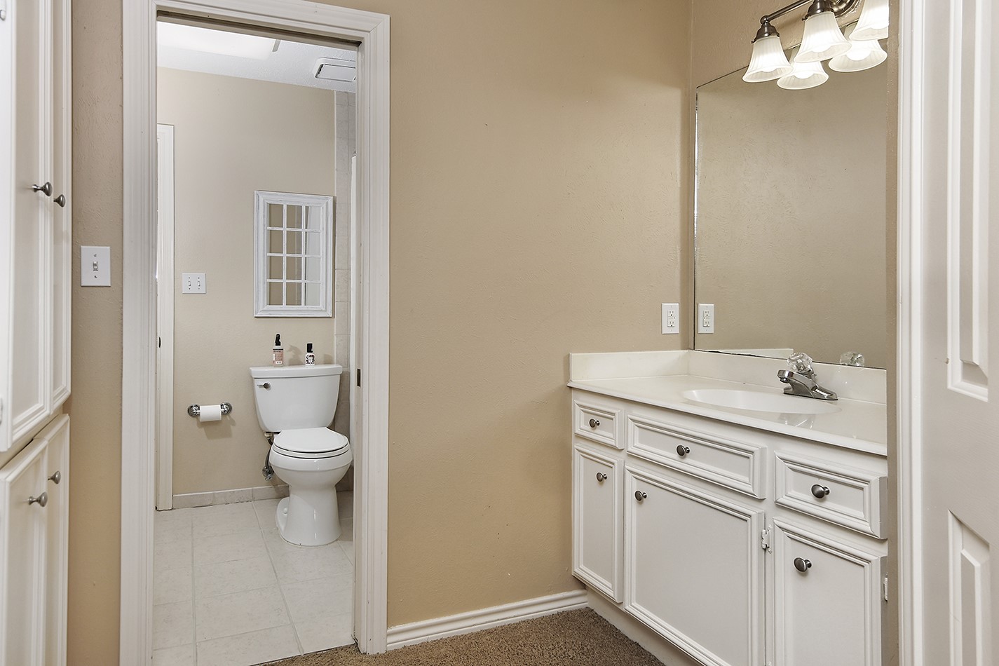 24635 West Kingscrest Circle Spring, TX 77389 - Photo 27 of 38 a bathroom with a sink a toilet and a mirror