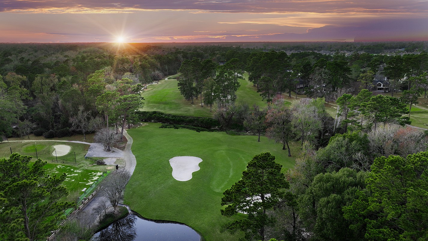 24635 West Kingscrest Circle Spring, TX 77389 - Photo 3 of 38 a view of a golf course with a lake in the background