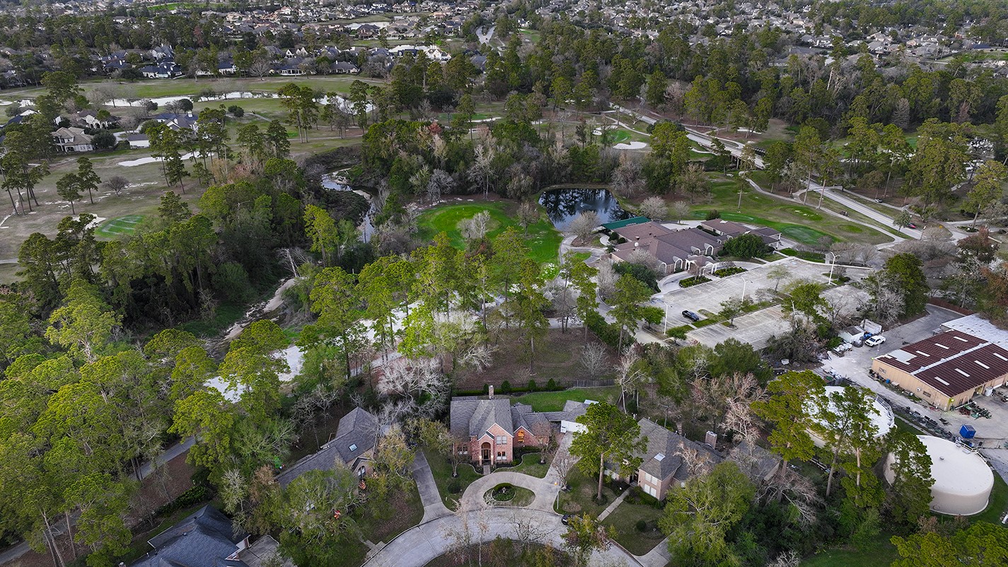 24635 West Kingscrest Circle Spring, TX 77389 - Photo 36 of 38 an aerial view of residential houses with outdoor space and trees