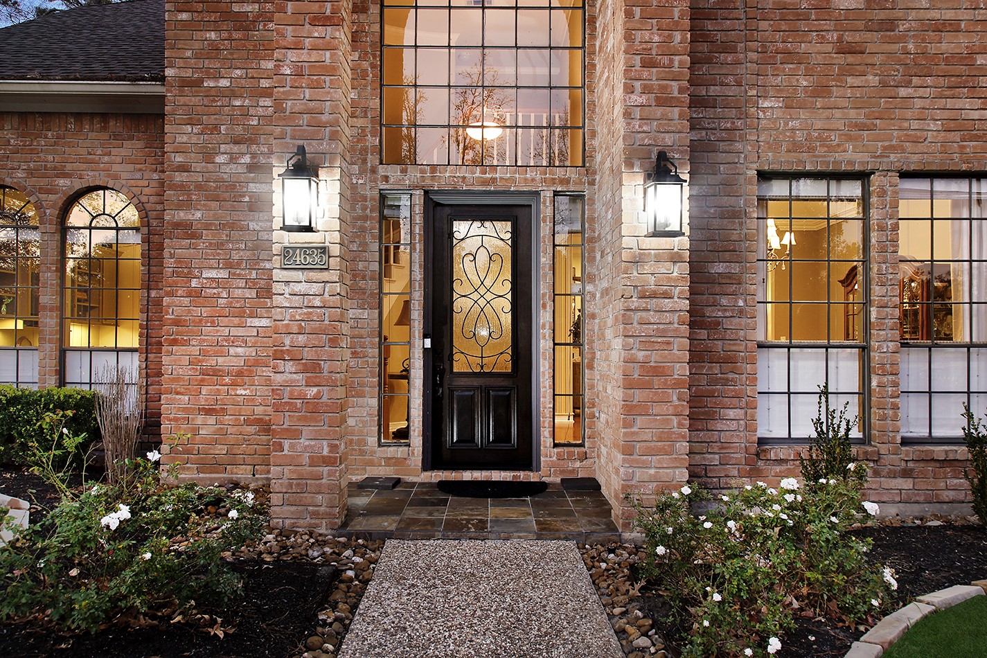 24635 West Kingscrest Circle Spring, TX 77389 - Photo 4 of 38 a front view of a house with a blue gate