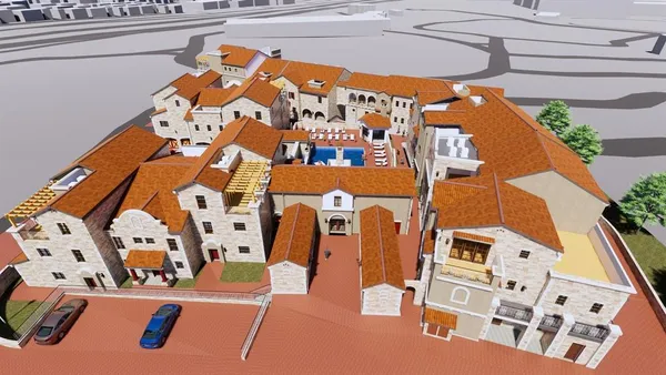 an aerial view of residential houses with outdoor space