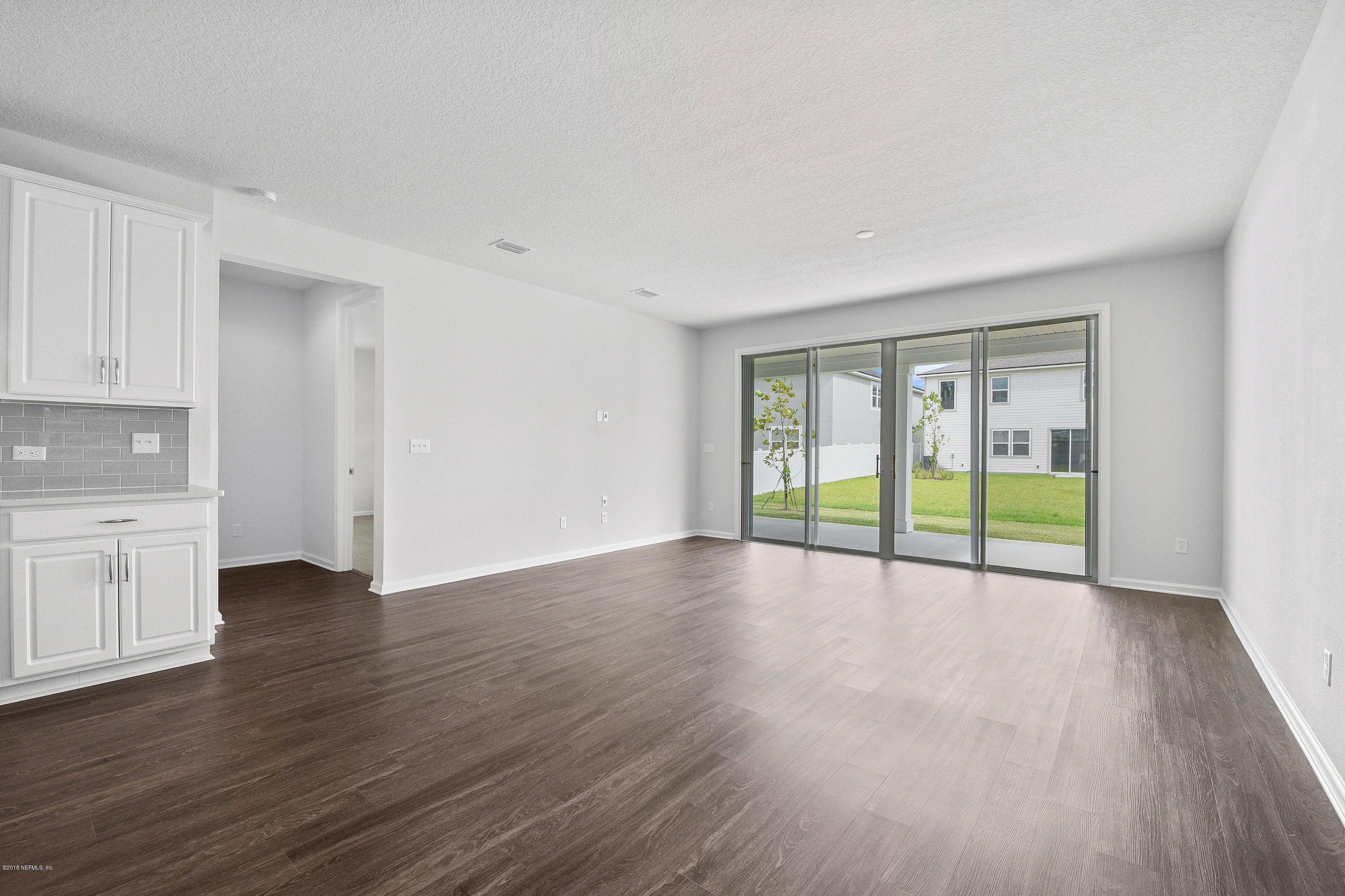 6625 Azalea Park Road Jacksonville, FL 32259 - Photo 11 of 26 a view of an empty room with wooden floor and a window