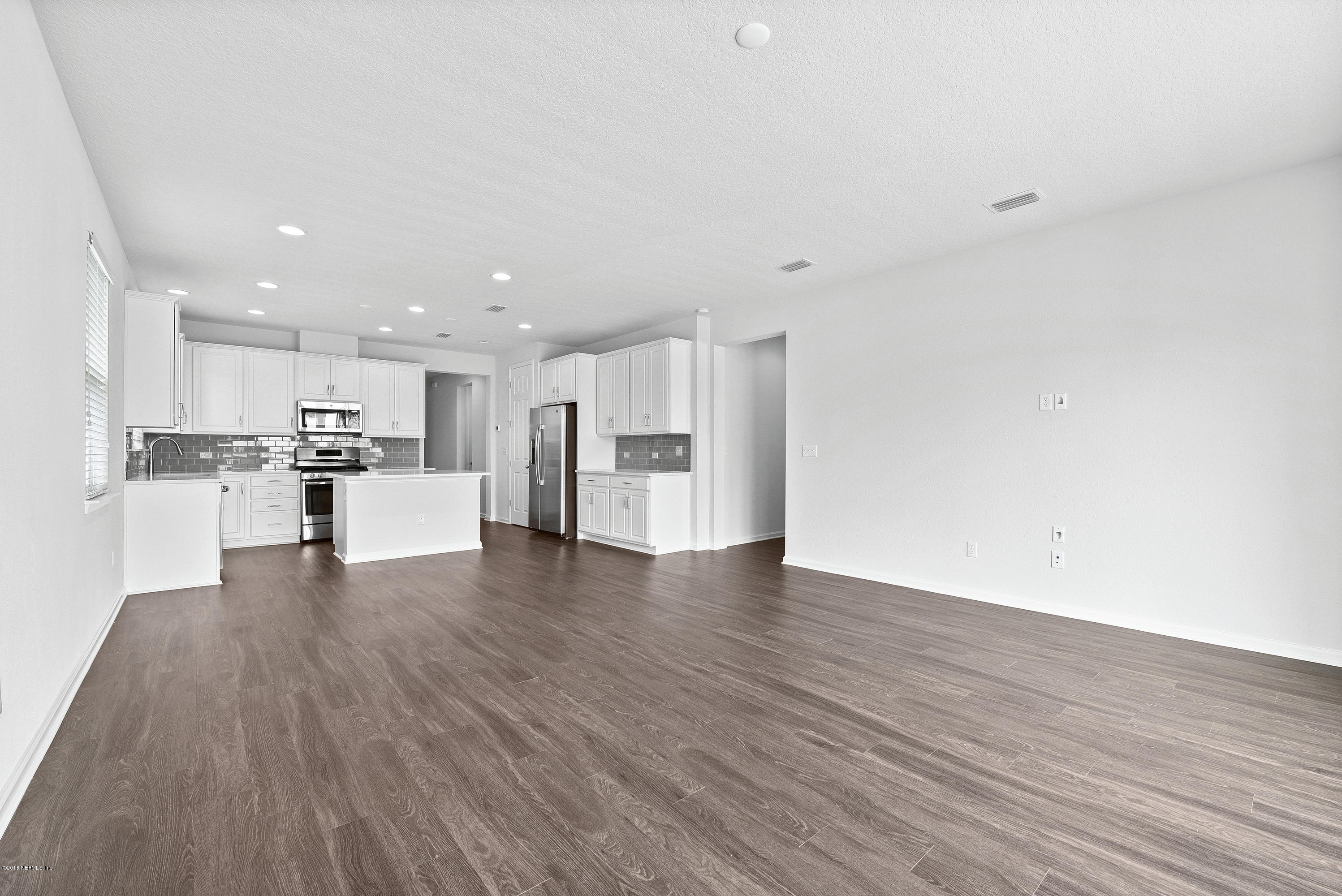 6625 Azalea Park Road Jacksonville, FL 32259 - Photo 12 of 26 a view of kitchen dining table chairs microwave and cabinets