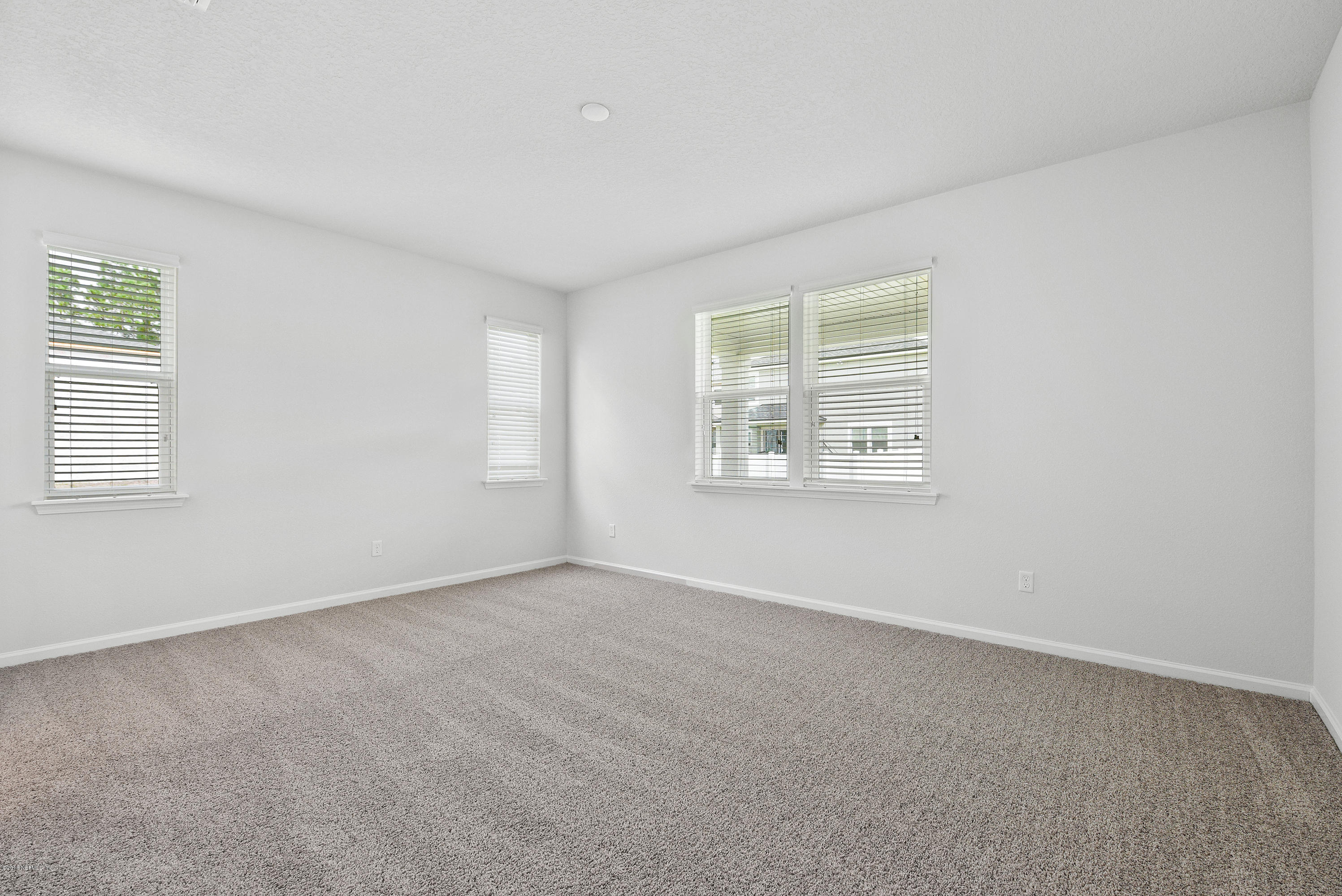 6625 Azalea Park Road Jacksonville, FL 32259 - Photo 14 of 26 an empty room with windows