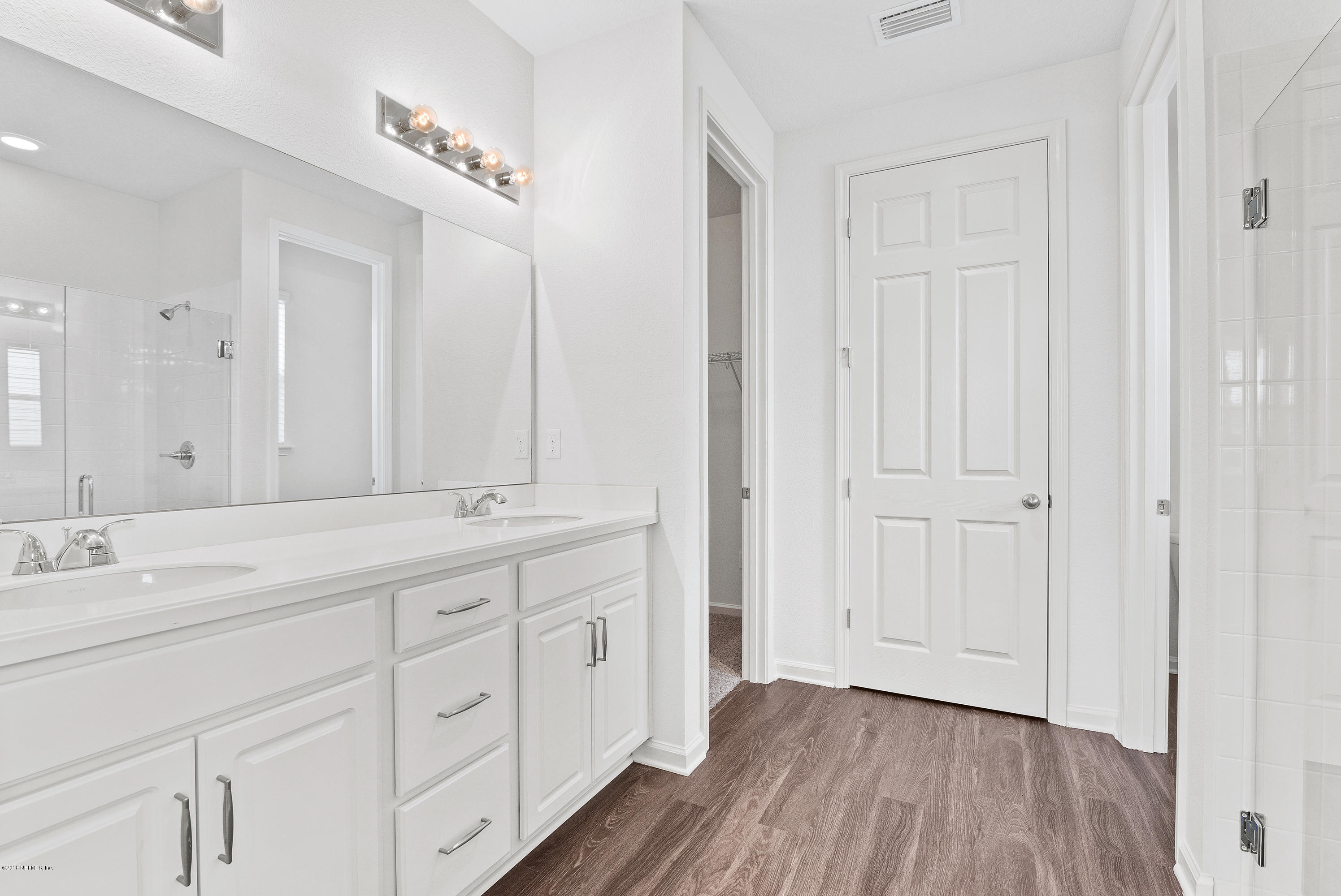 6625 Azalea Park Road Jacksonville, FL 32259 - Photo 17 of 26 a bathroom with a sink and a mirror