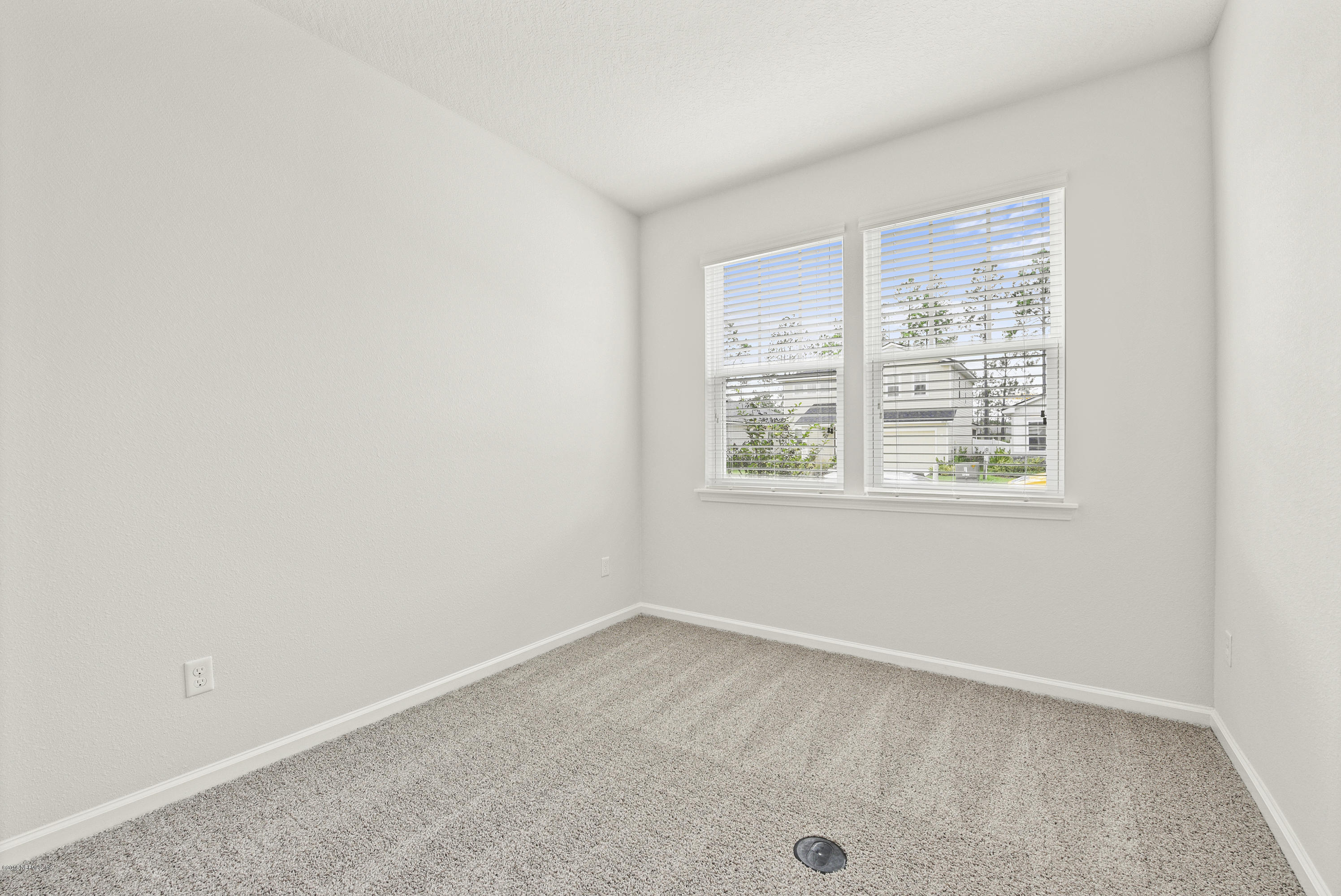 6625 Azalea Park Road Jacksonville, FL 32259 - Photo 18 of 26 an empty room with windows
