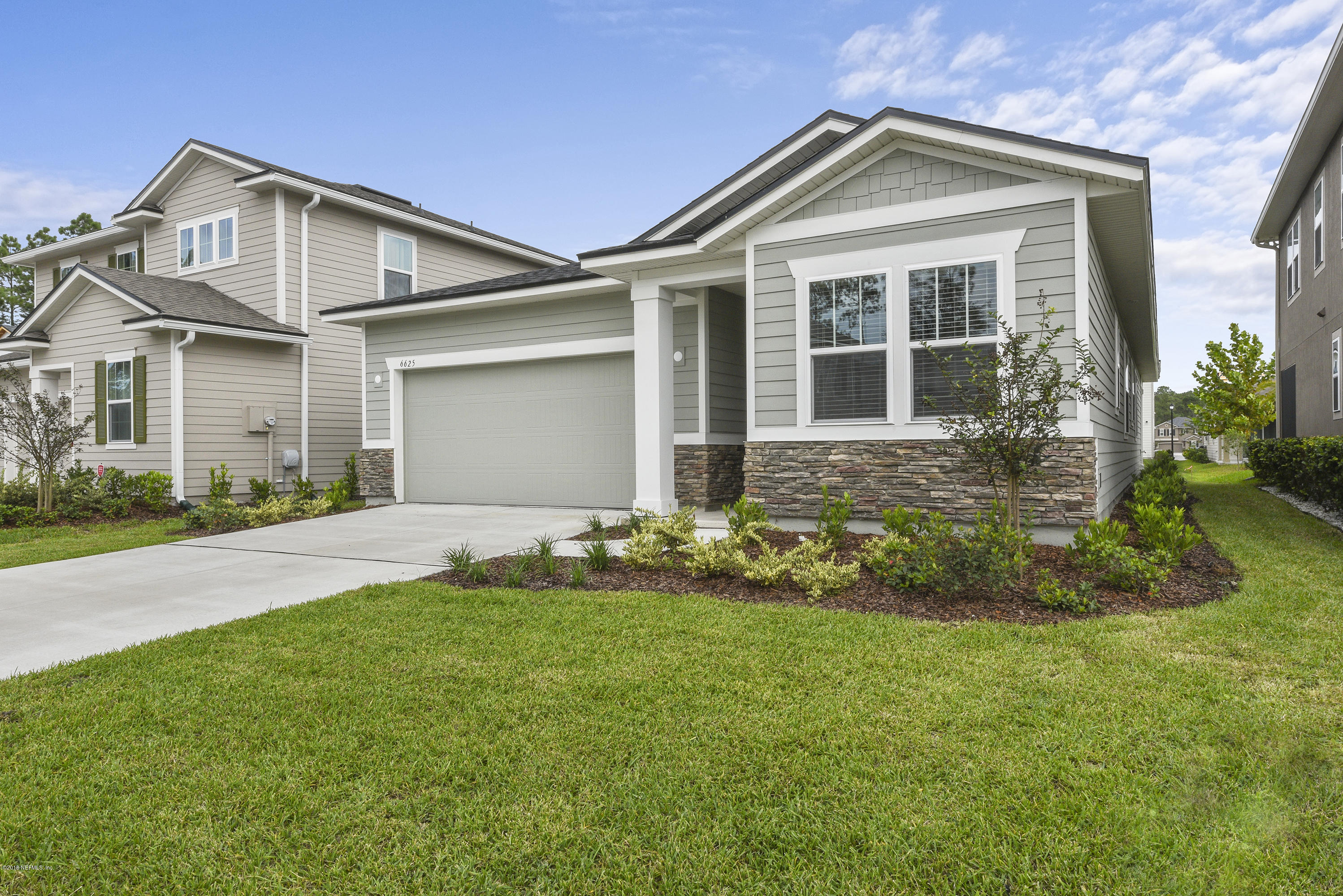6625 Azalea Park Road Jacksonville, FL 32259 - Photo 3 of 26 front view of a house with a yard