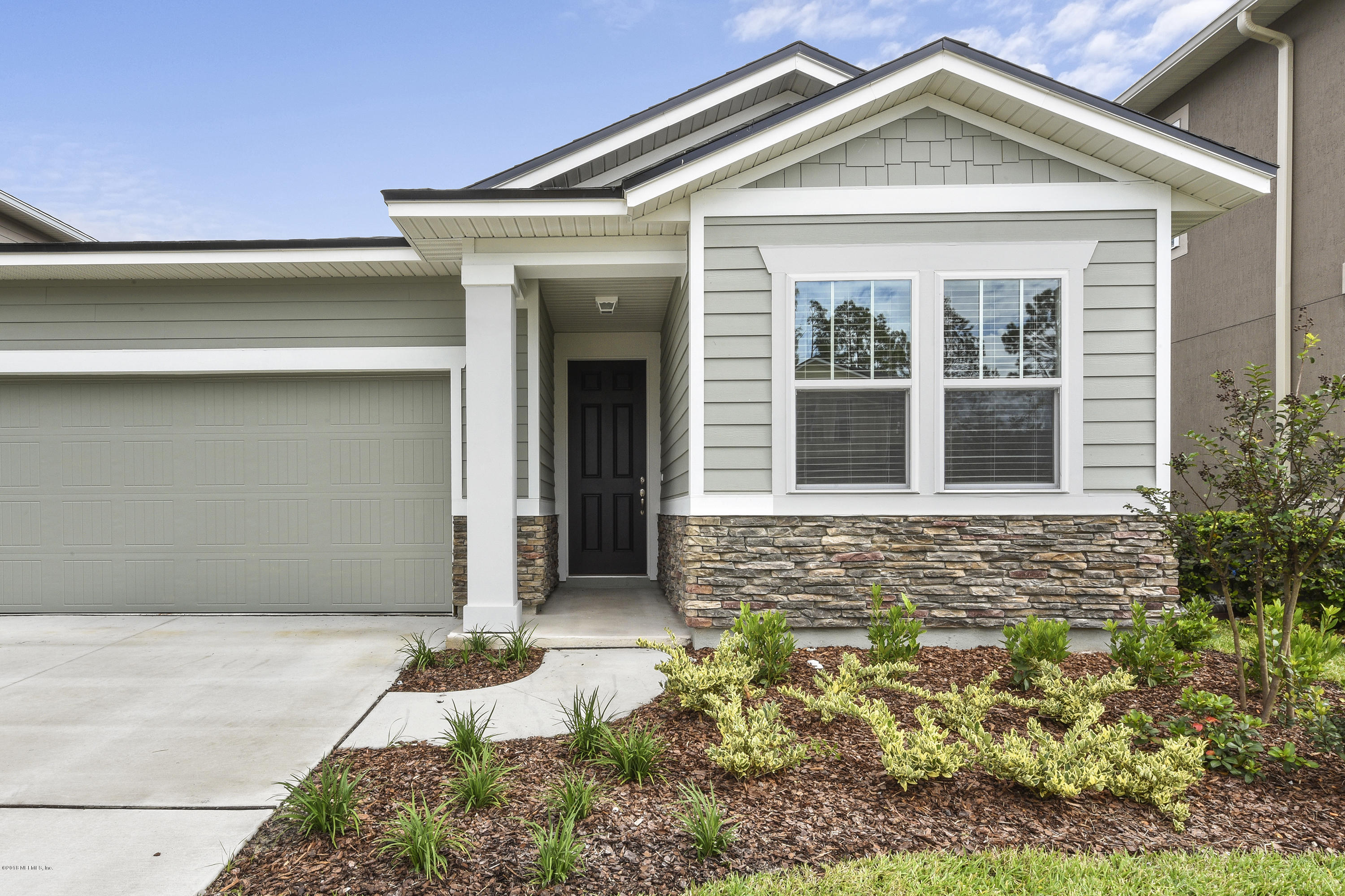 6625 Azalea Park Road Jacksonville, FL 32259 - Photo 4 of 26 a front view of a house with a yard