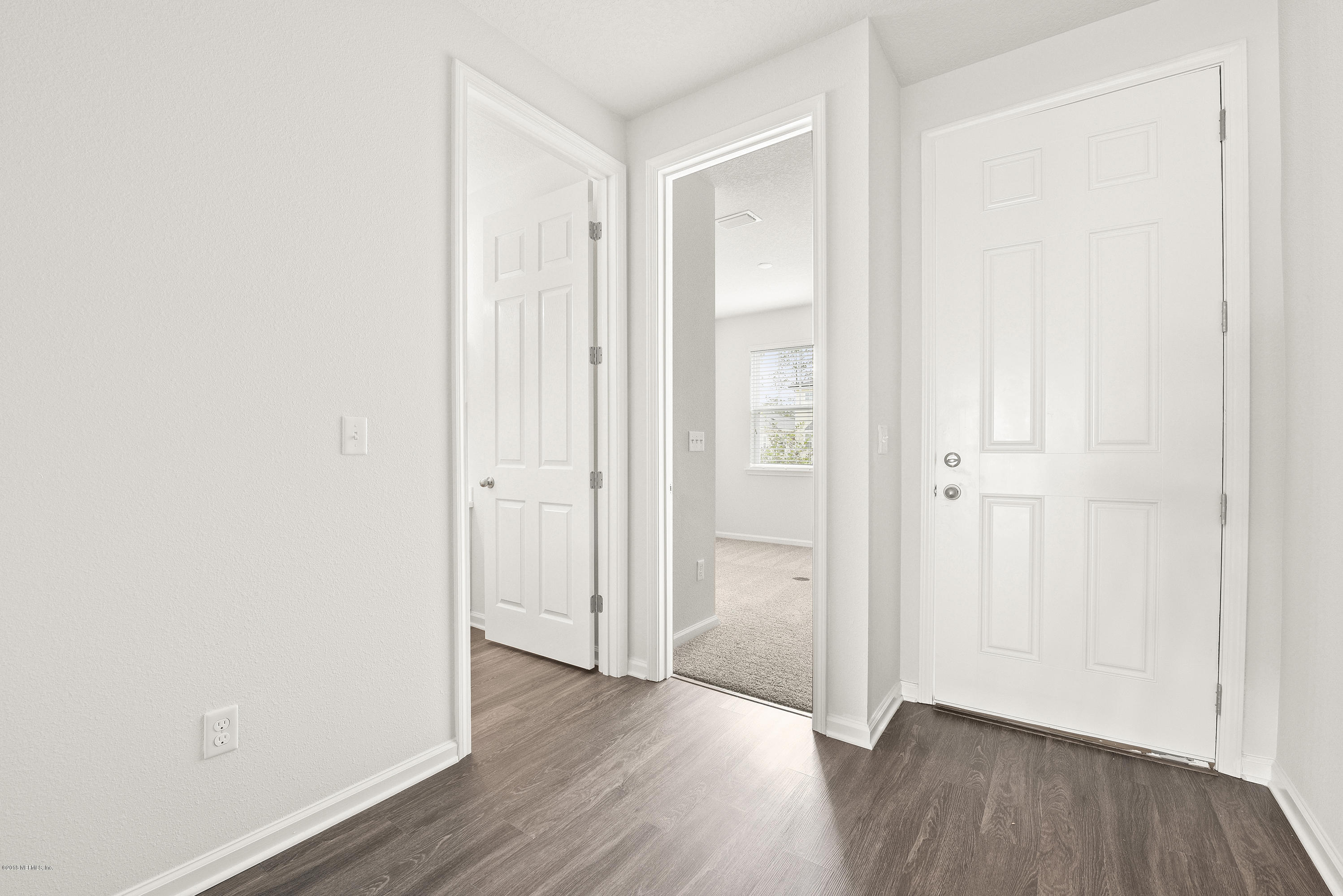 6625 Azalea Park Road Jacksonville, FL 32259 - Photo 5 of 26 an empty room with wooden floor and closet