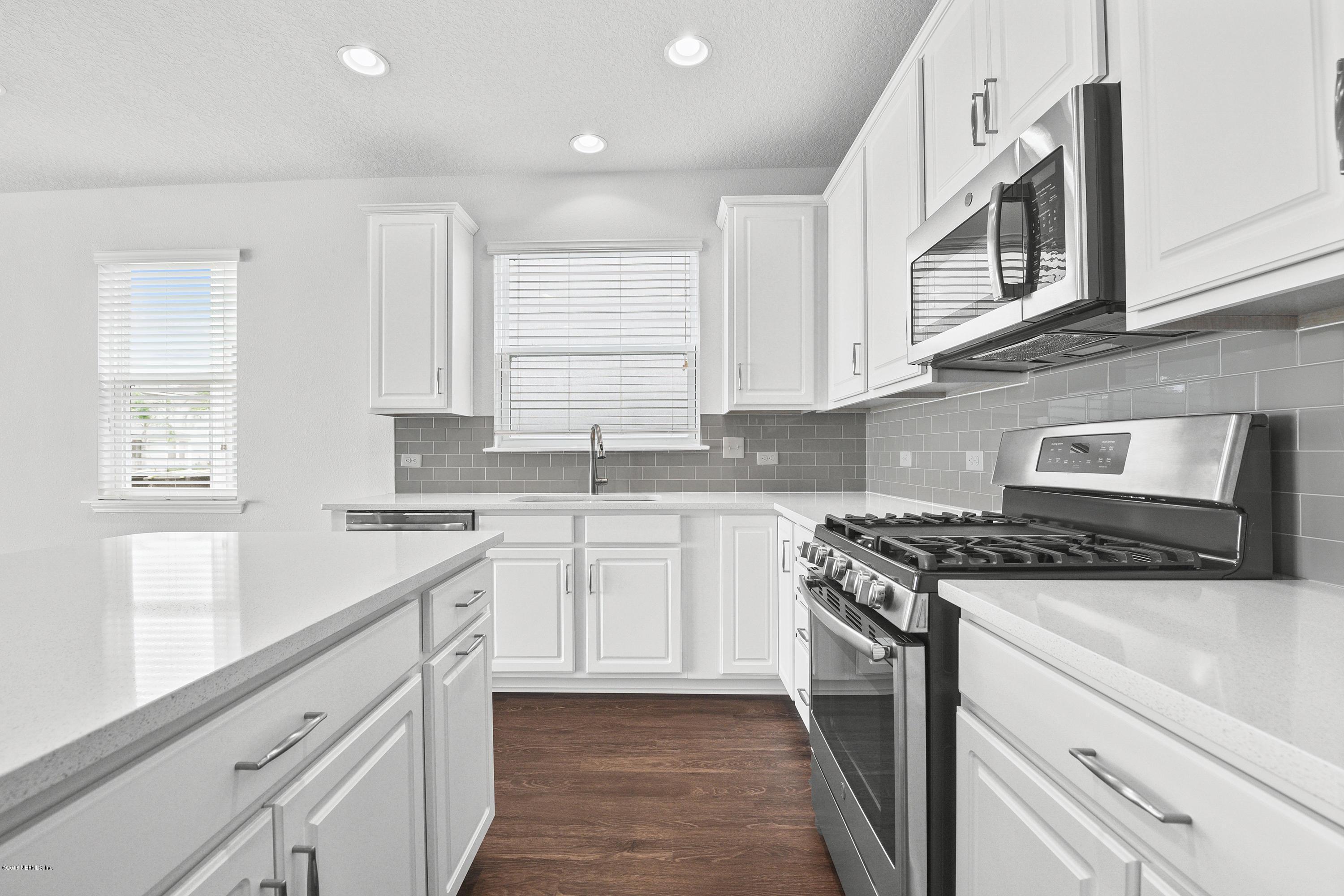 6625 Azalea Park Road Jacksonville, FL 32259 - Photo 9 of 26 a kitchen with stainless steel appliances granite countertop a sink and cabinets