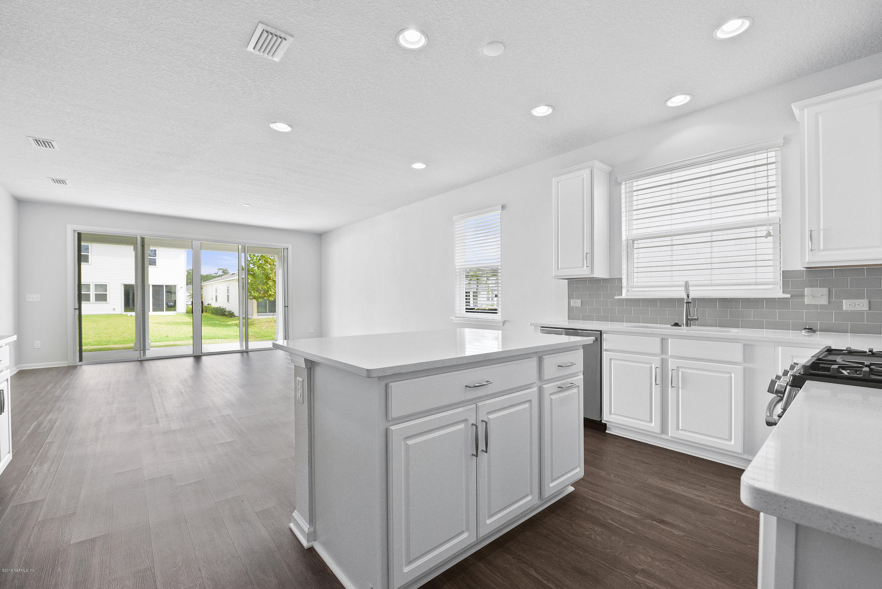 6625 Azalea Park Road Jacksonville, FL 32259 - Photo 10 of 26 a kitchen with a sink window and cabinets