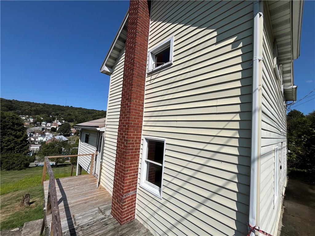 1008 38th Street Northern Cambria, PA 15714 - Photo 2 of 10 a view of a balcony with chair and wooden floor