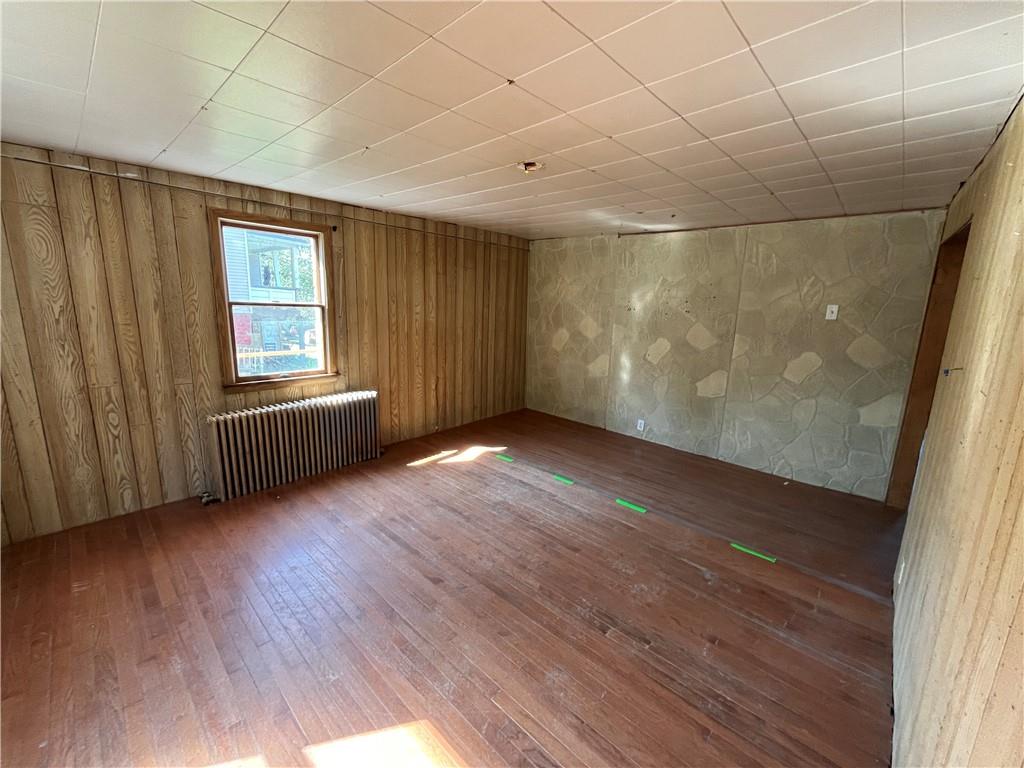 1008 38th Street Northern Cambria, PA 15714 - Photo 8 of 10 an empty room with wooden floor and windows