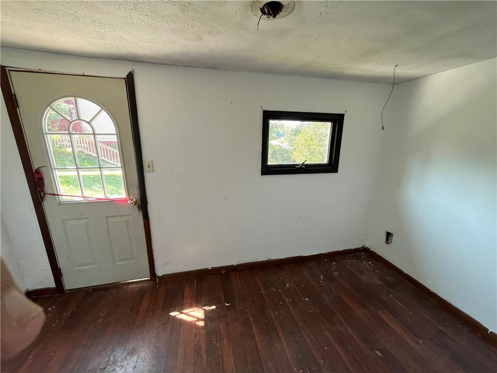 1008 38th Street Northern Cambria, PA 15714 - Photo 10 of 10 an empty room with wooden floor and windows