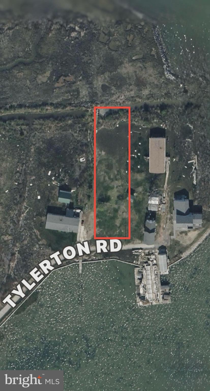 9-14 Tylerton Road Tylerton, MD 21866 - Photo 3 of 4 a room with water heater and a table