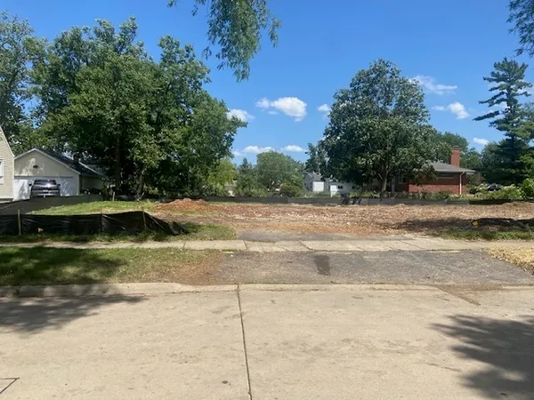 a view of swimming pool and a yard