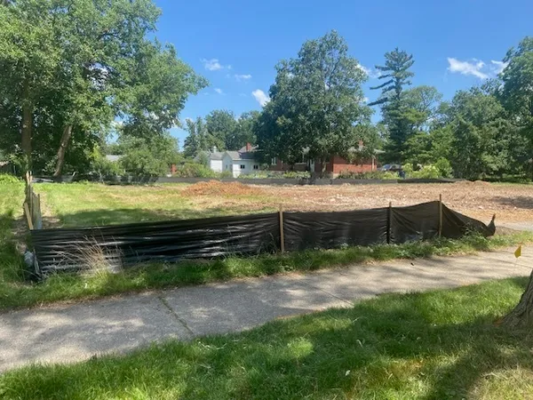 a view of a back yard of a house