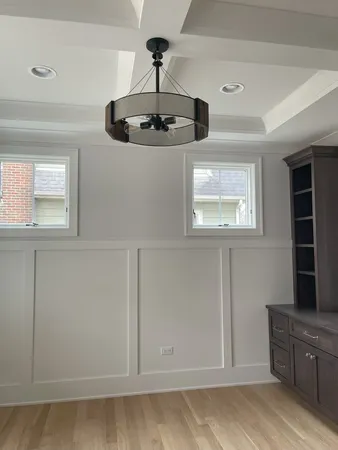 a kitchen with cabinets and window