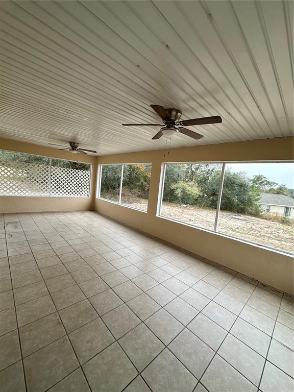 5140 Southwest 159th Street Ocala, FL 34473 - Photo 10 of 13 an empty room with windows