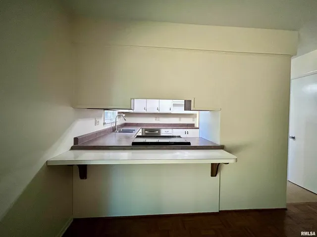 a view of washer and dryer with wooden floor