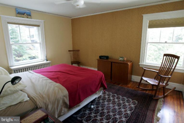 4 Longwood Road Baltimore, MD 21210 - Photo 14 of 23 a bedroom with a bed a chair and a window