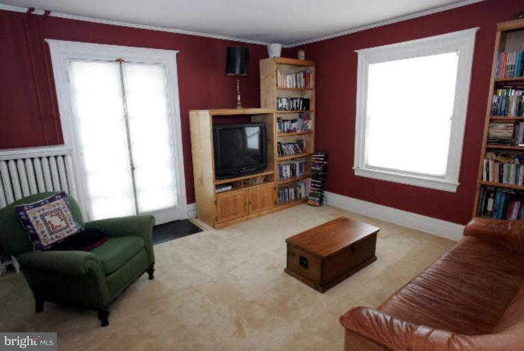 4 Longwood Road Baltimore, MD 21210 - Photo 16 of 23 a living room with furniture and a flat screen tv