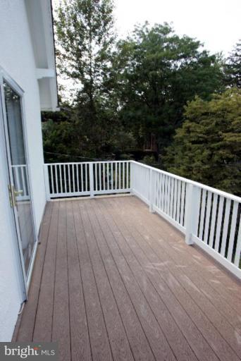 4 Longwood Road Baltimore, MD 21210 - Photo 18 of 23 a view of balcony with wooden floor