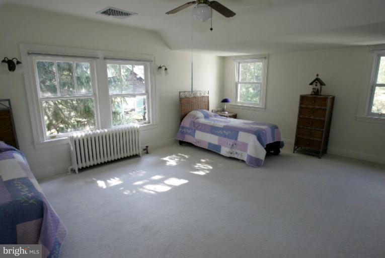 4 Longwood Road Baltimore, MD 21210 - Photo 20 of 23 a bedroom with a bed and a window