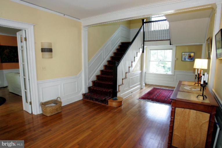 4 Longwood Road Baltimore, MD 21210 - Photo 3 of 23 a view of entryway and hall with wooden floor