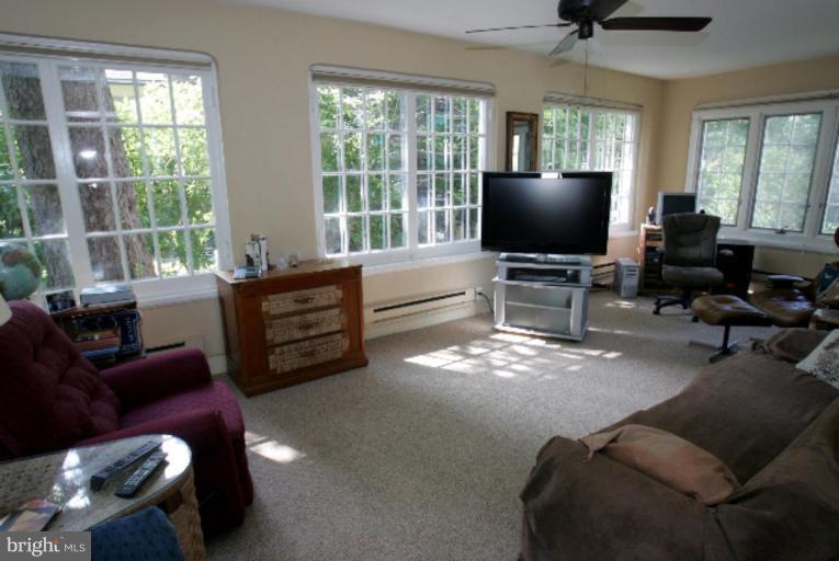 4 Longwood Road Baltimore, MD 21210 - Photo 5 of 23 a living room with furniture and a flat screen tv