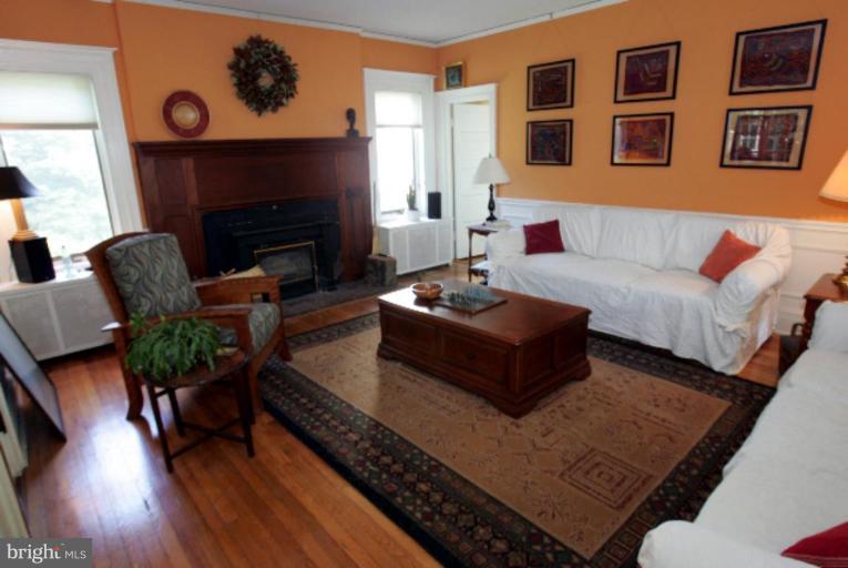 4 Longwood Road Baltimore, MD 21210 - Photo 6 of 23 a living room with furniture and a fireplace