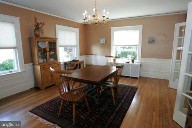 4 Longwood Road Baltimore, MD 21210 - Photo 8 of 23 a view of a dining room with furniture wooden floor and chandelier