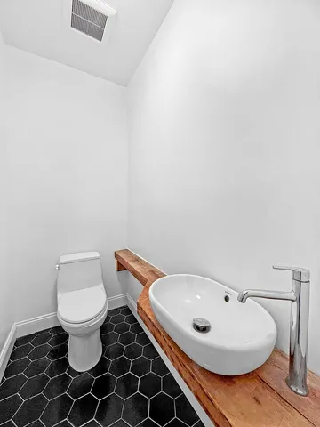 a bathroom with a toilet and a sink