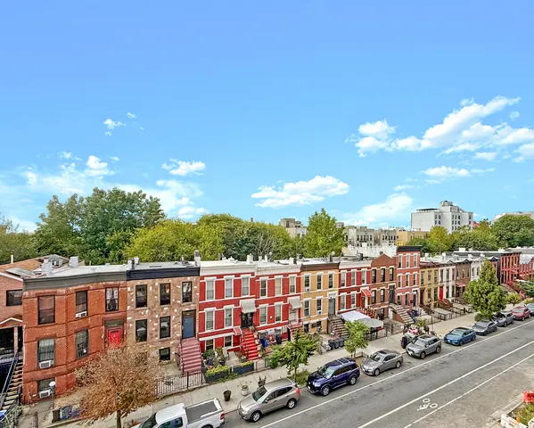 a view of city with tall buildings